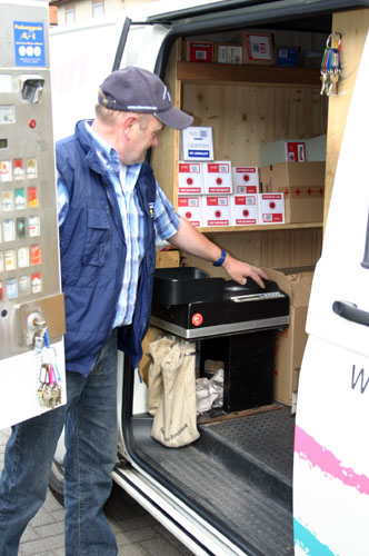 The ECC coin counting machine M202 in use